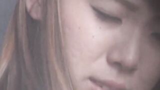 Brunette Japanese hottie kills time fingering her tight hole