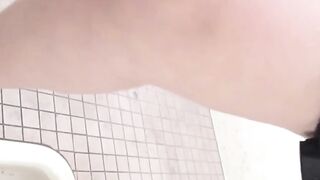 Asian ladies tailed by a voyeur until they piss in the toilet