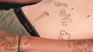 Tattooed dude smokes cigars while stroking gently