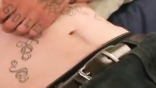 Tattooed dude smokes cigars while stroking gently