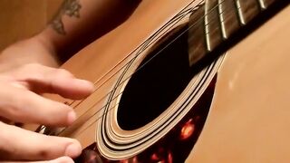 Handsome guy plays guitar while jerking off alone
