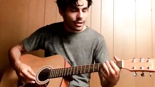 Handsome guy plays guitar while jerking off alone