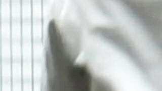 Hidden cam catches Japanese babe pulling thong up ass