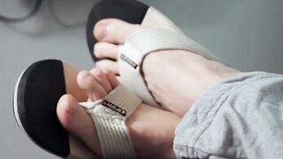 Cute hunk Aleck fists meat while baring his massive feet size