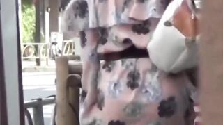 Voyeur catches Japanese babes skirts blown by the strong wind