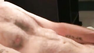 Tattooed older homo jerks his thick dick in bed