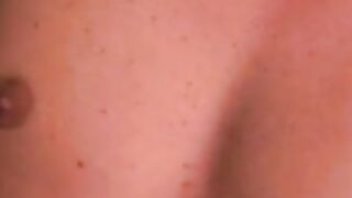 Charming tattooed guy lies back and strokes fat dick