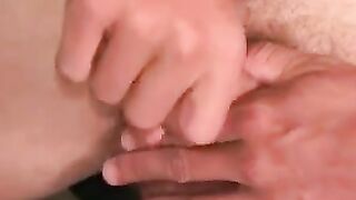 Charming tattooed guy lies back and strokes fat dick