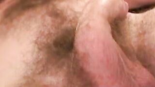 Hairy chested lad tugs his big hard shaft roughly