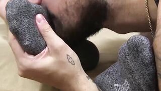 Bearded pro expertly licks toes through fabric