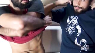 Bearded Ramiro and Sebas stroking each other's throbbing cocks