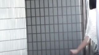 Pair of young Japanese women rush stall to share pee relief