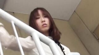 Young woman scans rooftop seeking spot for full bladder dump