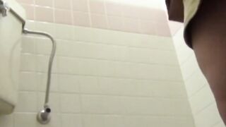 Camera watches Japanese ladies pee in a cramped restroom