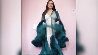 Busty Brunette's Sensual Striptease in BDSM-themed Lingerie