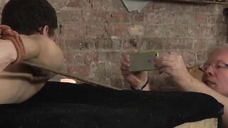 Bound slave suffers wax and spanking while being edged