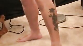 Tattooed stud relaxes before jerking to cumshot