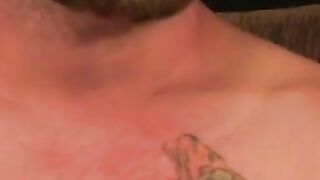 Tattooed stud relaxes before jerking to cumshot
