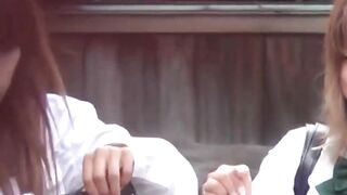 Two Asian babes spread their legs while a cam records secretly