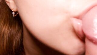 Redhead babe gives an intimate blowjob and handjob