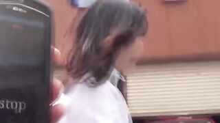 Cute girl hurries to park hunting quiet corner for pee break