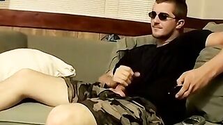 Handsome dude strokes firm cock to completion