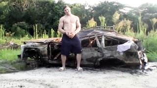 Muscular Elijah Knight jerks fat cock outside