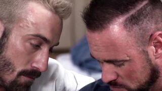 Tattooed muscle hunks trade rough anal on the bed