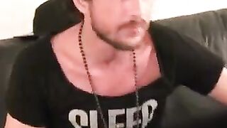 Inked thug rubs hairy cock before blasting cum