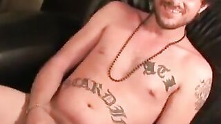 Inked thug rubs hairy cock before blasting cum