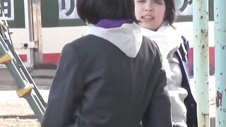 Two women in skirts compete to see who can pee the farthest