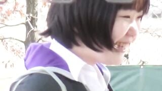 Two women in skirts compete to see who can pee the farthest