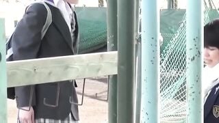 Two women in skirts compete to see who can pee the farthest