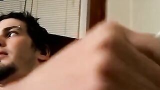 Guitar player strums while stroking hairy cock