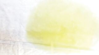 Witness a lovely lady fill a container with her warm urine