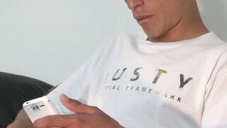 Twink Adrian strokes cock while grabbing his balls