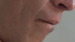 Twink Adrian strokes cock while grabbing his balls