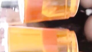 Babe collects her piss in a container and shows it to camera