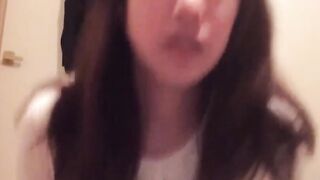 Horny babe records herself filling a cup with warm pee