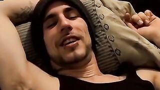 Tattooed dude puffs cigars while jerking slowly