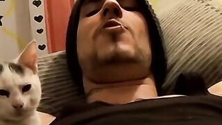 Tattooed dude puffs cigars while jerking slowly