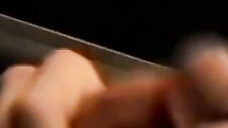 Tattooed dude puffs cigars while jerking slowly
