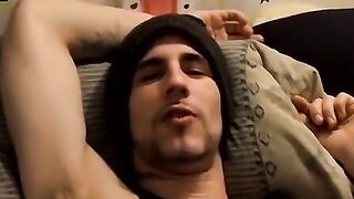 Tattooed dude puffs cigars while jerking slowly