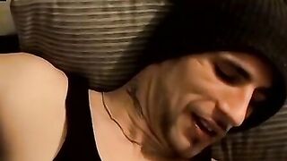 Tattooed dude puffs cigars while jerking slowly