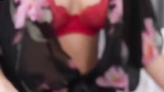 Red panties stands out nicely against Sharon White's soft skin as she gets herself dolled