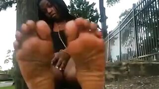 Ebony Girls Show Off Their Feet by the Roadside