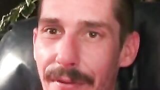 Rough dude smokes while jerking off during the interview