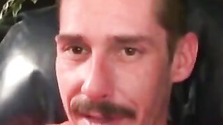 Rough dude smokes while jerking off during the interview