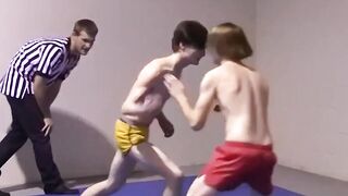 Lester Braxston and Adam Clark twist wrestle with boss Tye