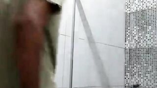 Twink David Scott jams his cock in the bathroom while watching porn